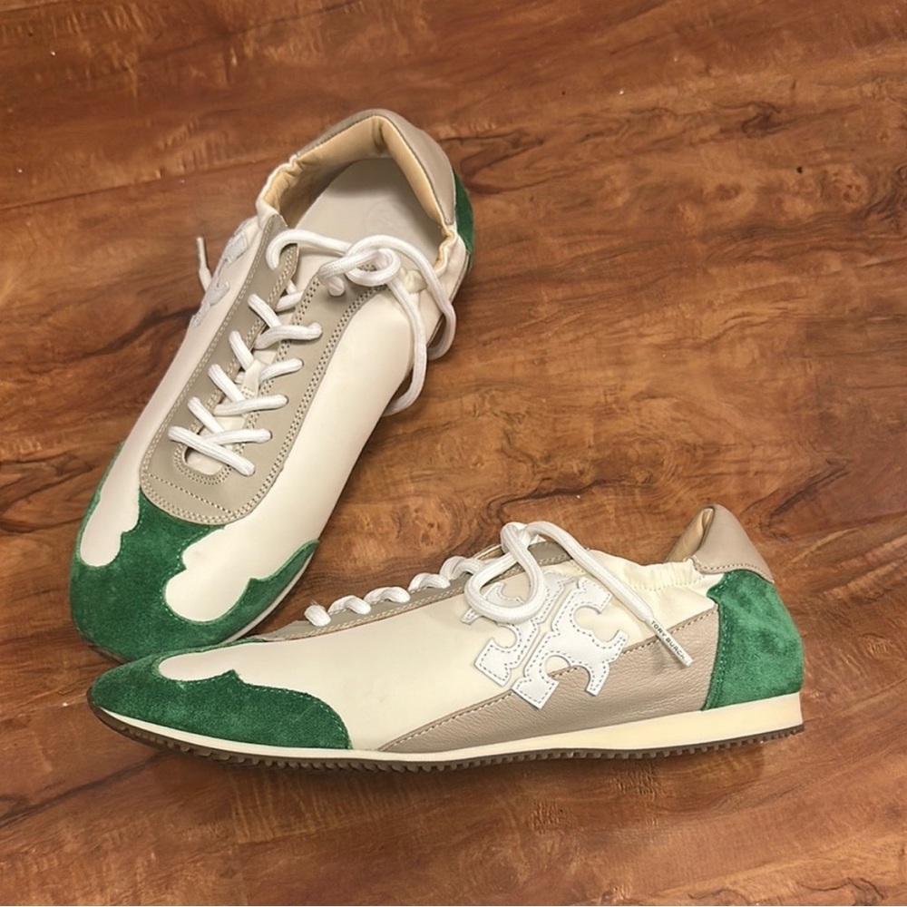 Tory Burch women’s white and green sneakers.
